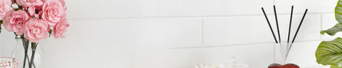 Home fragrance essentials with diffusers, candles, and room sprays