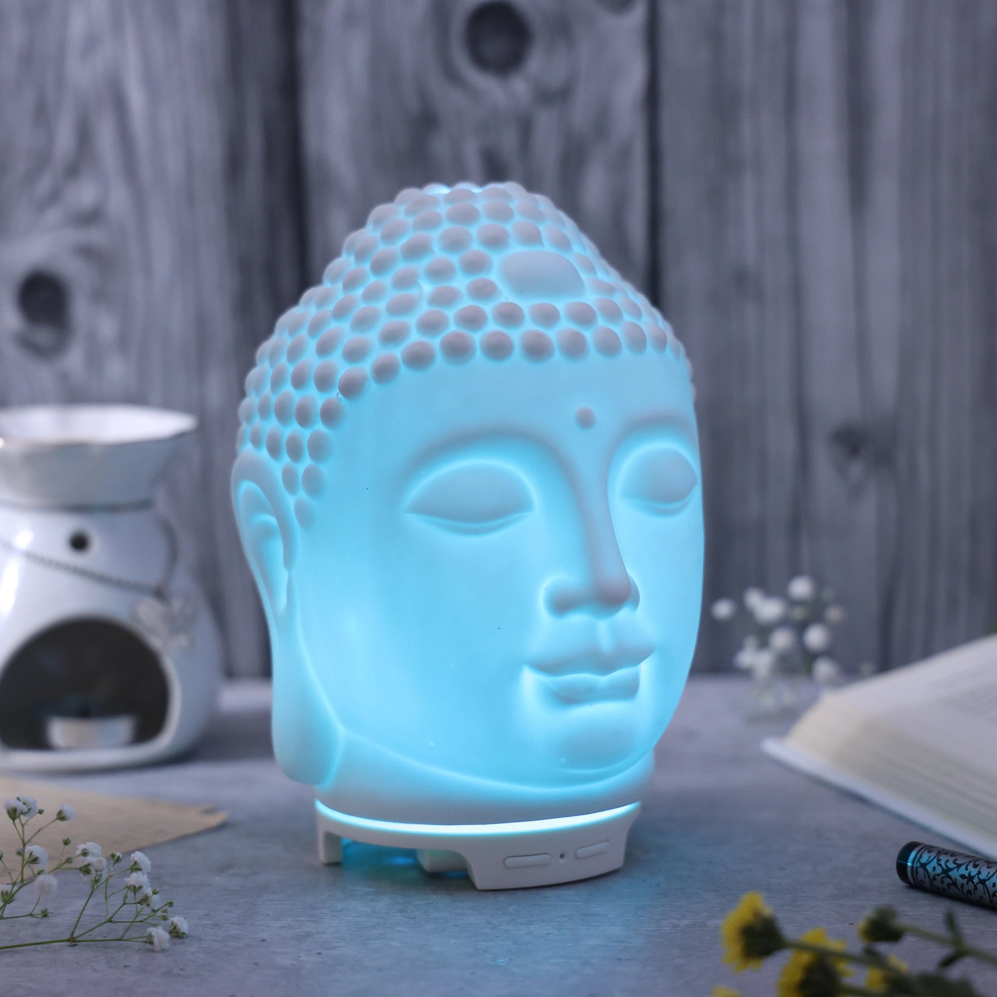 IRIS Celeste Buddha Ceramic Ultrasonic Aroma Diffuser lifestyle Background with light